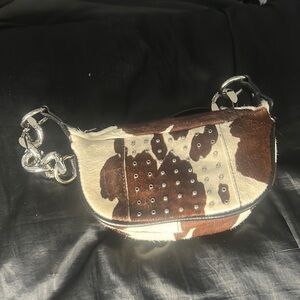 Urban Outfitters faux cowprint mini chain bag